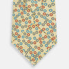 View 3 of product The Turnbull & Asser Multi-coloured Circle Yellow Silk Tie, crafted from fine English silk, features a vibrant pattern of multicoloured circles and is elegantly displayed rolled on a white background.