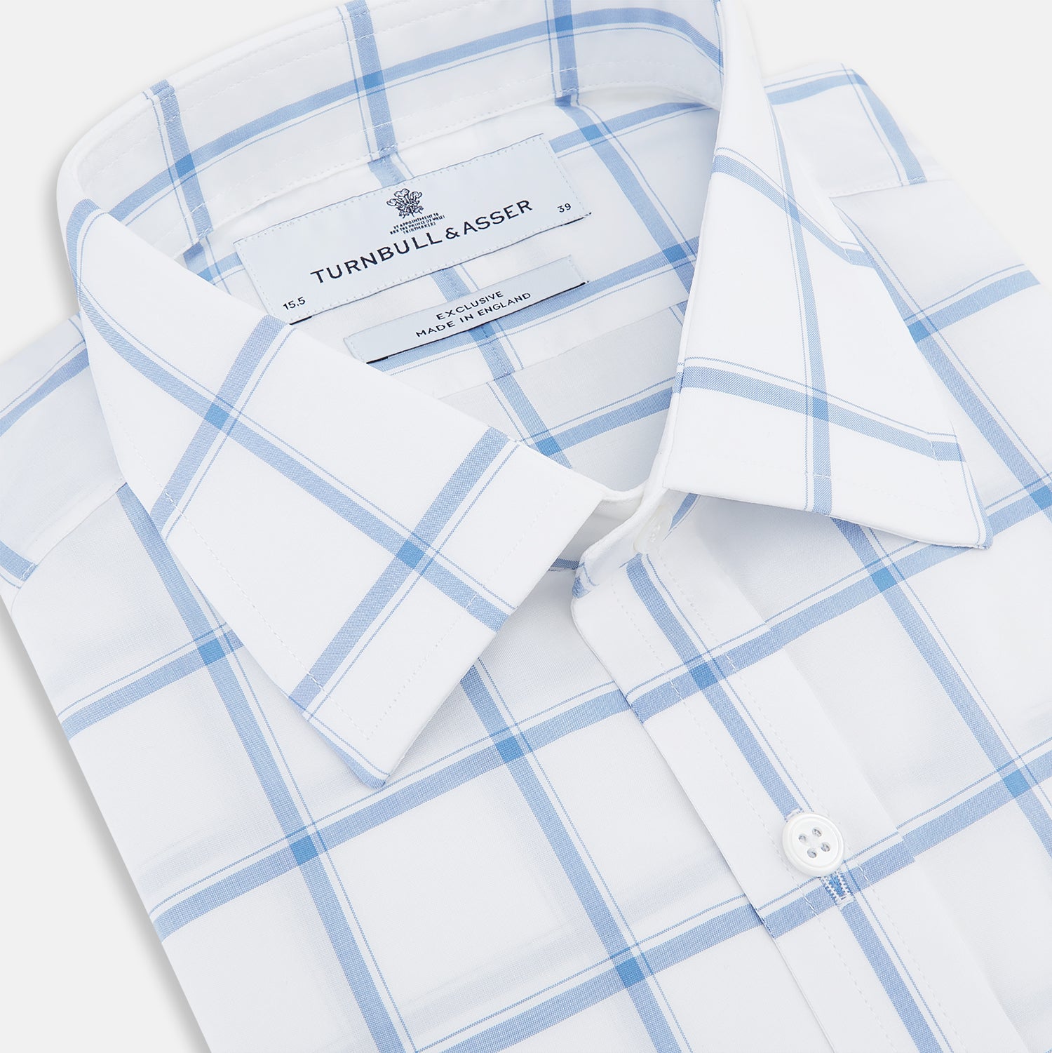 View 2 of product The Turnbull & Asser Colony Blue Grid Check Mayfair Shirt features long sleeves, a button-down front, Italian cotton fabric, a spread collar, and buttoned cuffs, shown against a plain white background.
