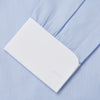 View 3 of product The Turnbull & Asser Micro Blue Check with White Collar and Cuff Shirt, a light blue long-sleeve style, features contrasting white collar and cuffs, buttoned down the front and laid flat on a white background.