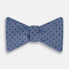 View 1 of product The Turnbull & Asser Blue Micro Dot Silk Bow Tie features a subtle textured pattern with small navy polka dots, shown on a white background—an ideal accessory for smart attire.