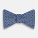 The Turnbull & Asser Blue Micro Dot Silk Bow Tie features a subtle textured pattern with small navy polka dots, shown on a white background—an ideal accessory for smart attire.