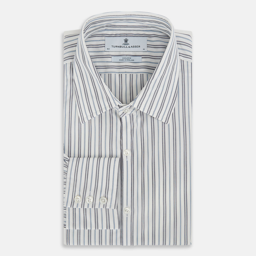 The Turnbull & Asser Navy and Light Blue Multi Track Stripe Westminster Shirt, featuring a button-up design with long sleeves and a signature collar, is displayed flat to highlight its expert British craftsmanship.