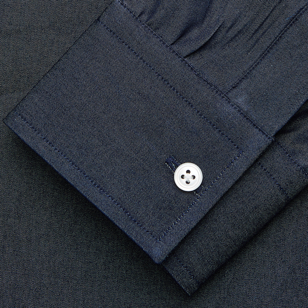 The Turnbull & Asser Blue Weekend Fit Finch Shirt features a Derby collar, chest pocket, classic white buttons, and timeless style, all in cotton. Laid flat on a white background.