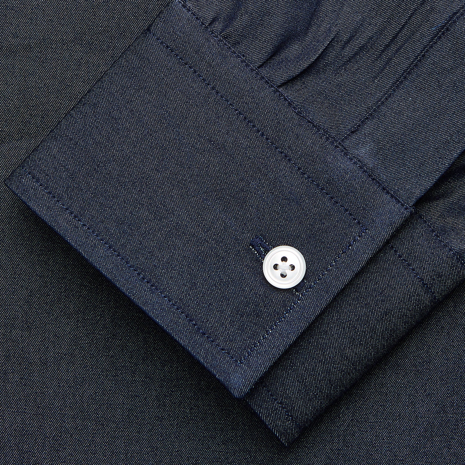 View 3 of product The Turnbull & Asser Blue Weekend Fit Finch Shirt features a Derby collar, chest pocket, classic white buttons, and timeless style, all in cotton. Laid flat on a white background.