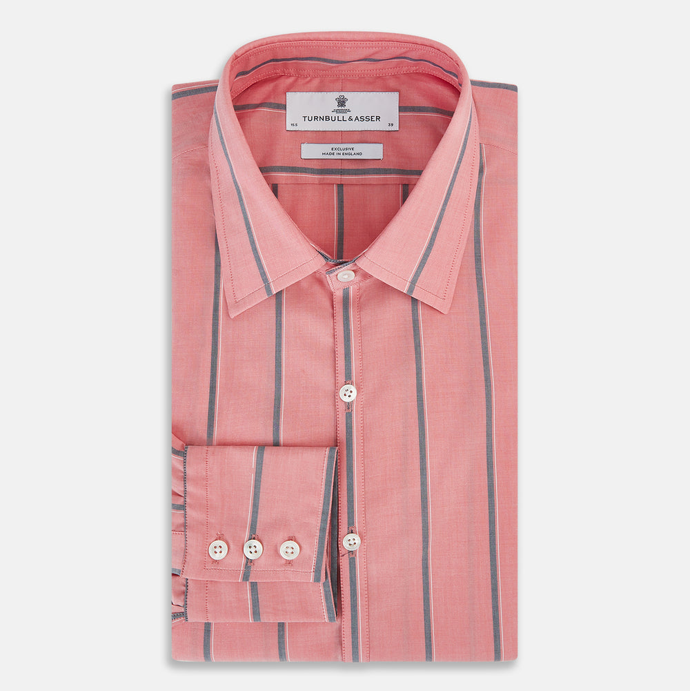 The Coral Pink Track Stripe Westminster Shirt by Turnbull & Asser features vertical navy and white stripes, a tailored fit, pointed collar, and buttoned cuffs—is displayed laid flat on a white background.