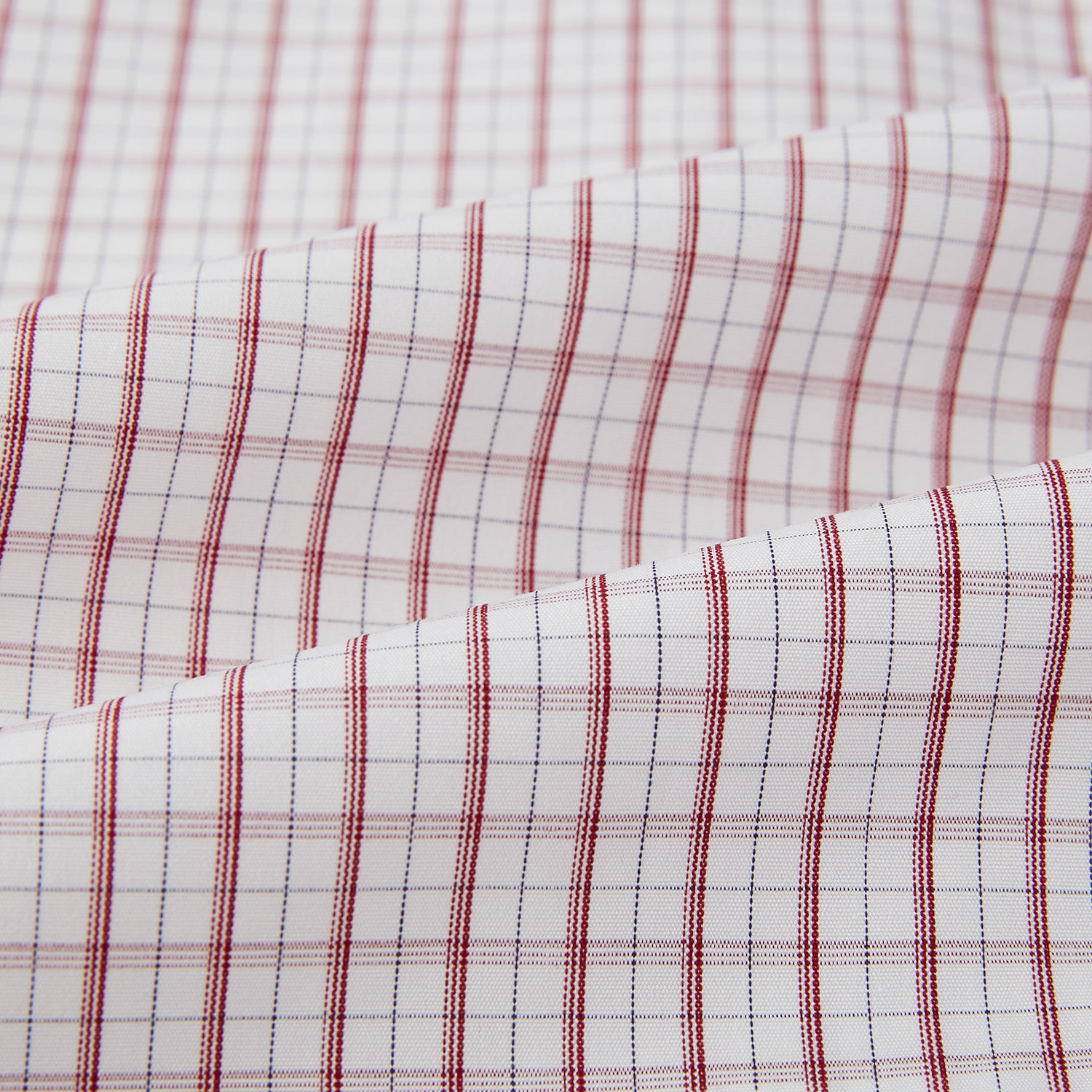 View 6 of product The Turnbull & Asser Red Tattersall Check Mayfair Shirt features long sleeves, a collar, and Italian cotton with a red tattersall check on white, shown flat against a white background.