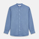 The Turnbull & Asser Blue Cotton Weekend Fit Blake Shirt features a light blue color, long sleeves, stand collar, white buttons, and a curved hem—ideal for casual weekends. Laid flat on a white background.