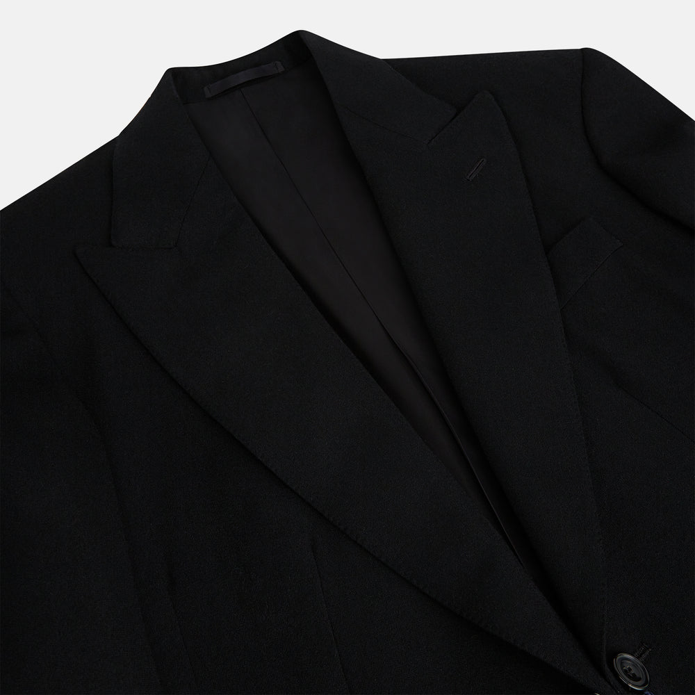 The Turnbull & Asser Black Morning Coat features satin peak lapels, a single front button closure, and long sleeves, shown against a plain white background.