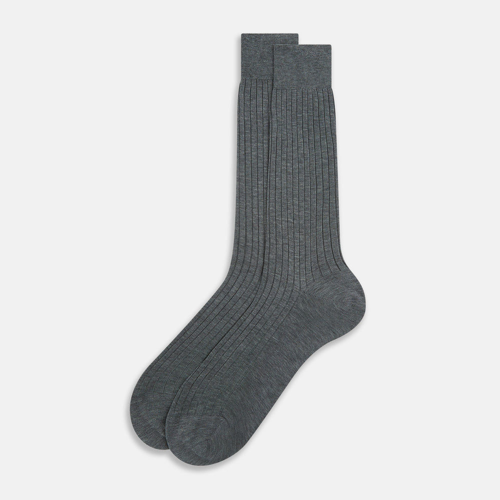 The Ash Mid-Length Sock by Turnbull & Asser, shown upright on a plain white background, is a single dark gray ribbed knee-high made from mercerised Egyptian cotton.