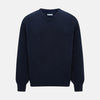 View 1 of product The Turnbull & Asser Navy Cashmere V-neck Jumper features long sleeves with ribbed cuffs and hem, shown against a white background.