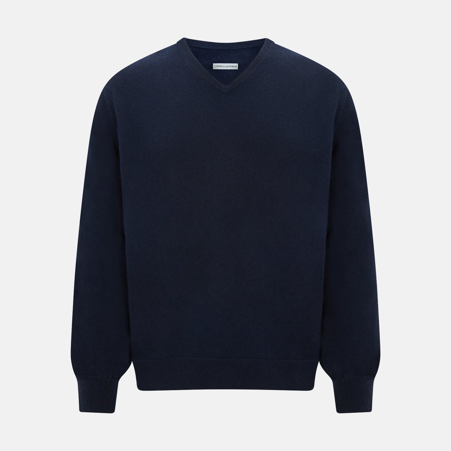 View 1 of product The Turnbull & Asser Navy Cashmere V-neck Jumper features long sleeves with ribbed cuffs and hem, shown against a white background.
