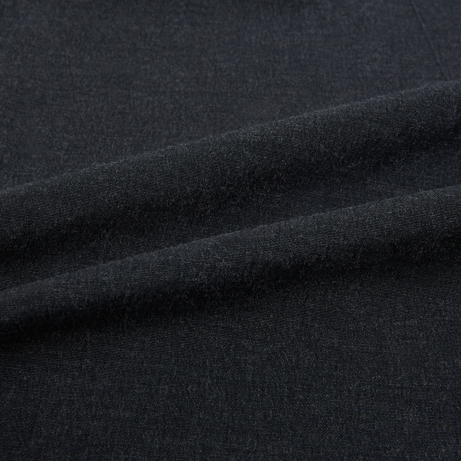 View 8 of product The Turnbull & Asser Midnight Blue Westminster Shirt features long sleeves, a button-up front, classic collar, and buttoned cuffs in a plain design—showcasing British craftsmanship—laid flat on a white background.