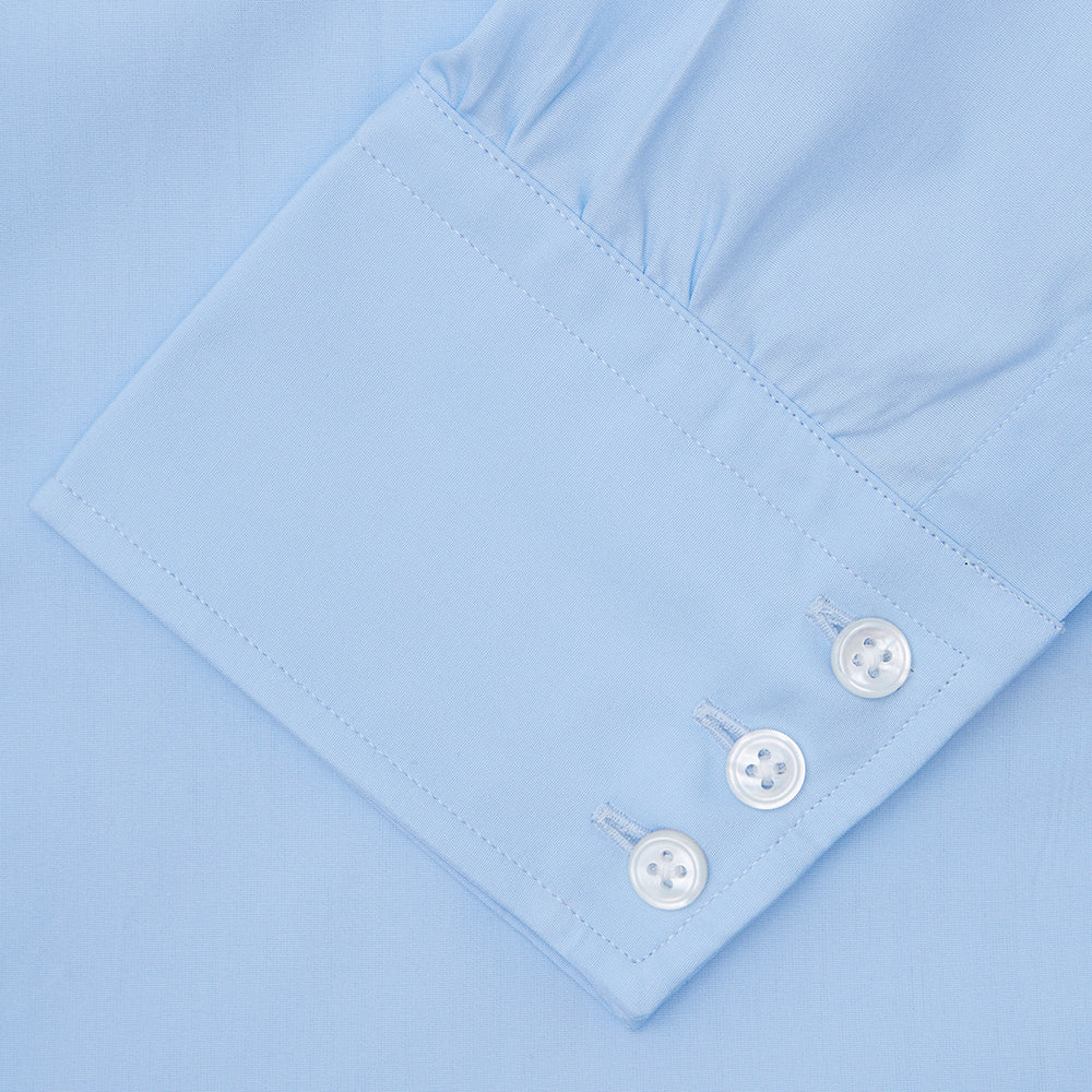 A Light Blue Cotton Shirt with a T&A collar and 3-button cuffs by Turnbull & Asser is displayed on a plain white background, ideal for pairing with a navy suit.