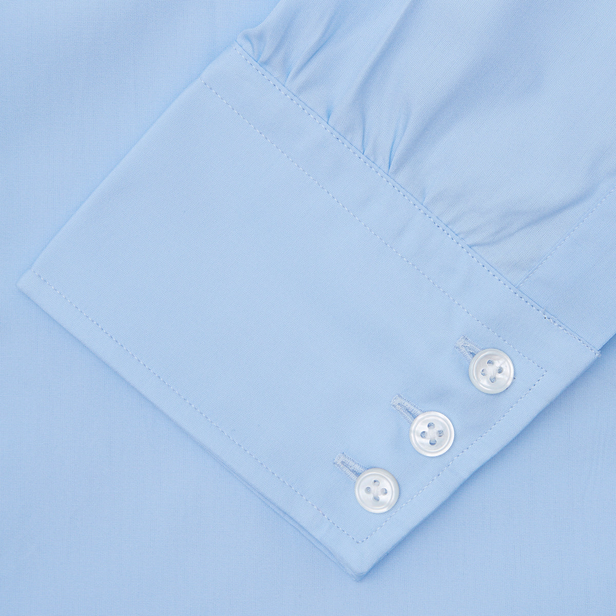 View 3 of product A Light Blue Cotton Shirt with a T&A collar and 3-button cuffs by Turnbull & Asser is displayed on a plain white background, ideal for pairing with a navy suit.