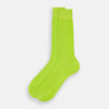 View 2 of product The Turnbull & Asser Lime Mid-Length Sock is crafted from soft mercerised cotton with a ribbed texture and shown against a plain light gray background.