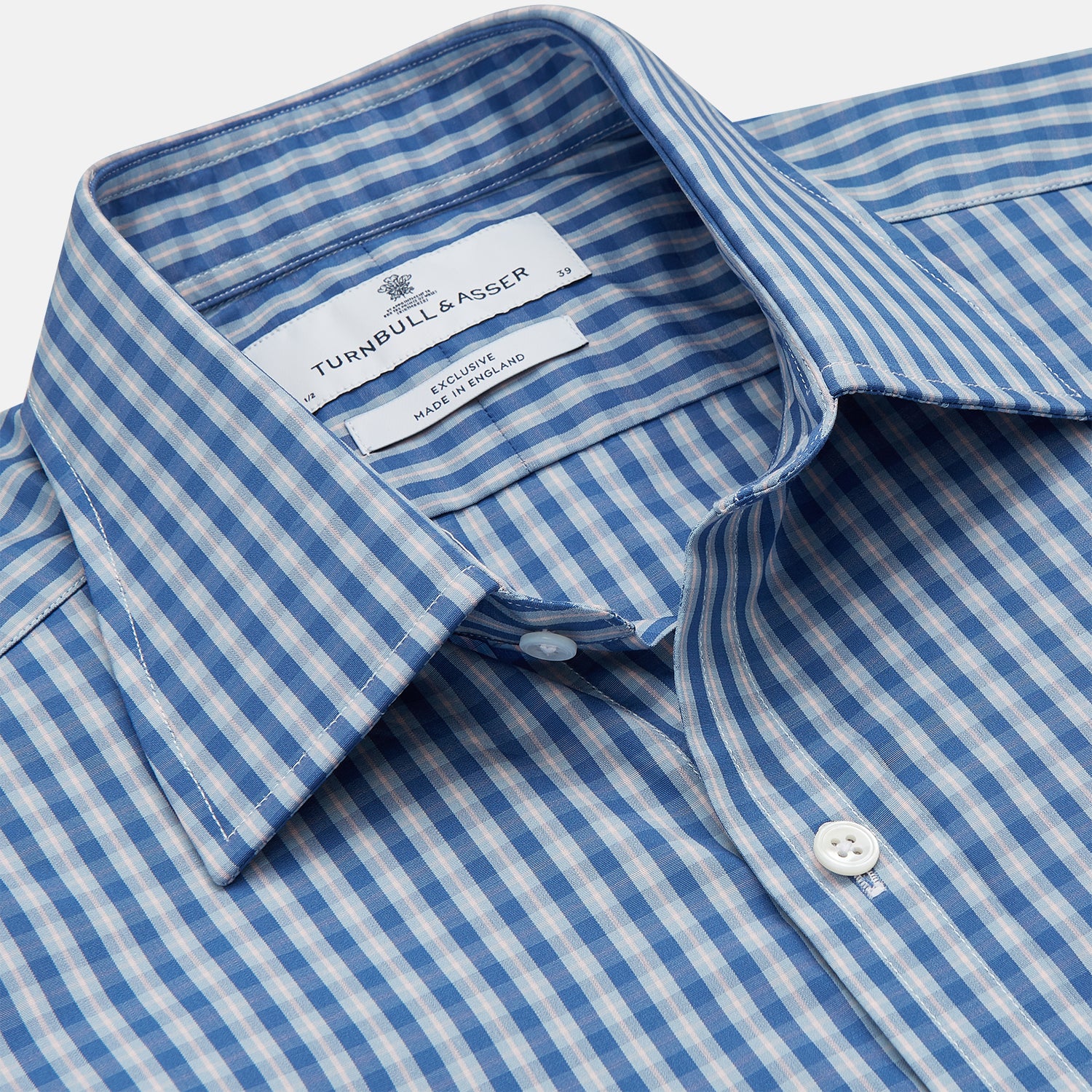 View 2 of product The Turnbull & Asser Navy Multi Check Cotton Regular Fit Mayfair Shirt features long sleeves, button-down front, collar, and buttoned cuffs in a navy and white check pattern, shown against a plain white background.