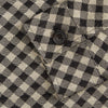 View 3 of product The Turnbull & Asser Black Gingham Check Wool Blend Somerset Overshirt features long sleeves, two chest flap pockets with buttons, and a black-and-beige check pattern. Shown laid flat on a white background; ideal as transitional outerwear.