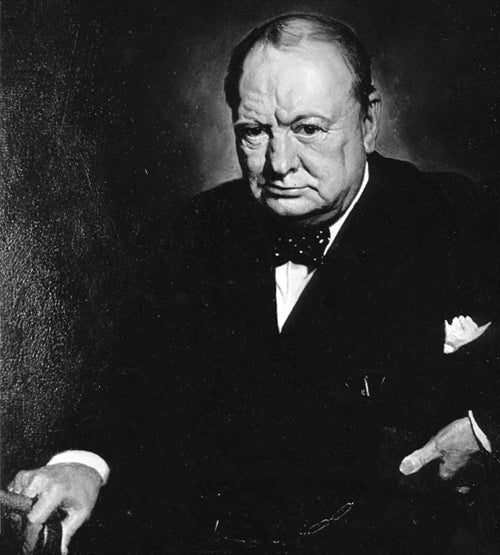 A serious older man in a dark suit and bow tie sits with one hand resting on a chair. The background is dark, and the lighting highlights his stern expression. This image appears to be a formal portrait.