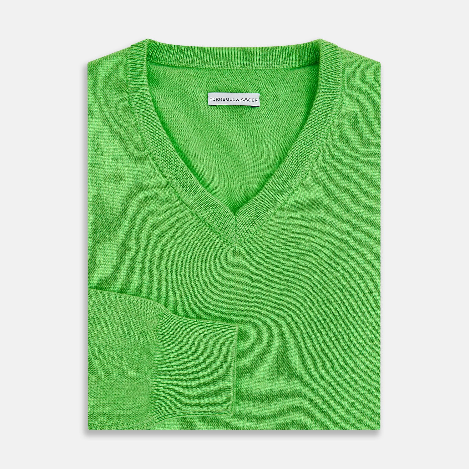 View 3 of product The Turnbull & Asser Lime Green Cashmere V-Neck Jumper features long sleeves and ribbed cuffs, hem, and neckline—ideal for adding vibrant color to your knitwear collection. Displayed on a white background.