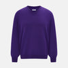 View 1 of product The Turnbull & Asser Purple Merino V-Neck Jumper features long sleeves and a rich, solid hue, making it an essential knitwear piece for any wardrobe.