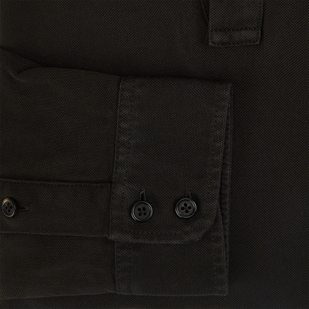 A brown Rugby Polo Shirt by Turnbull & Asser, made of pure cotton with long sleeves, a collar, and a short buttonless placket, is laid flat on a white background.