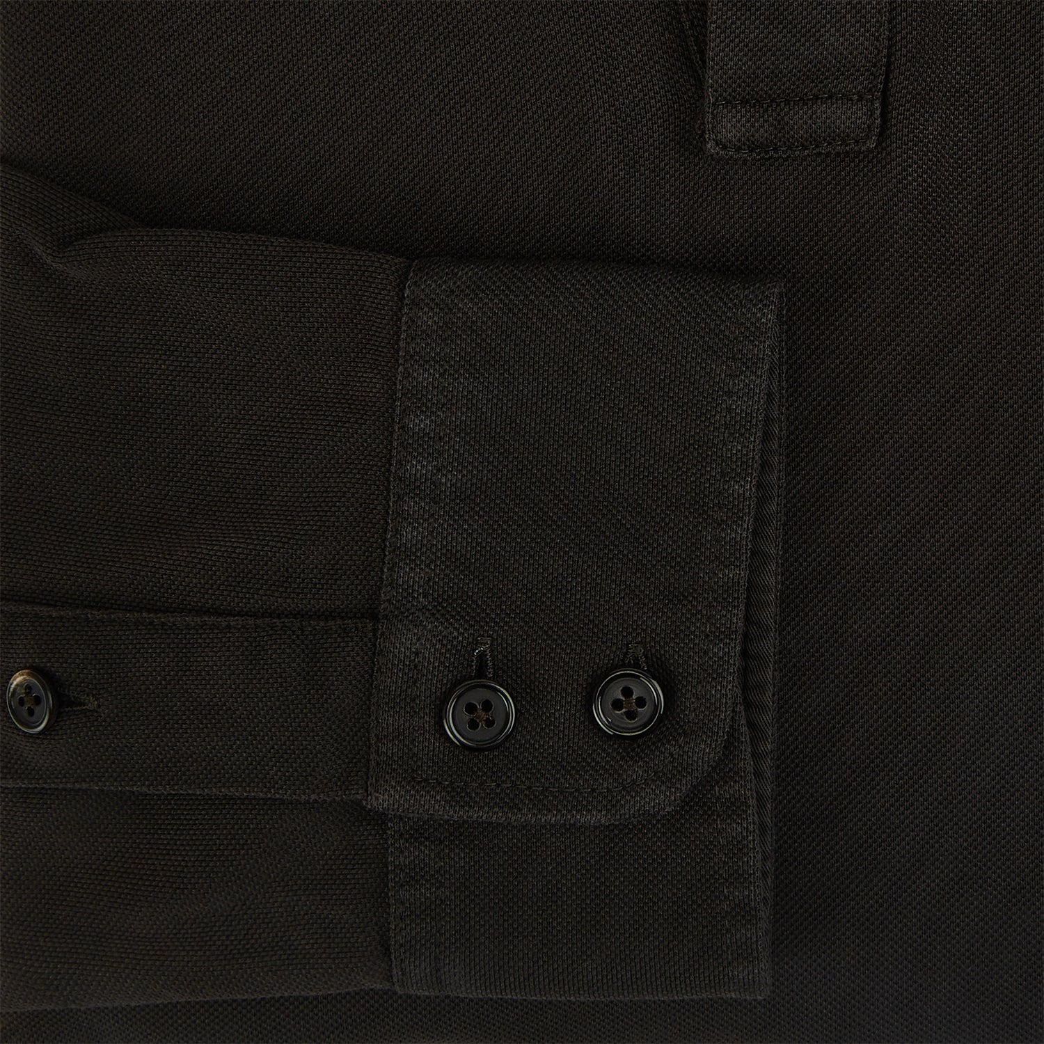 View 4 of product A brown Rugby Polo Shirt by Turnbull & Asser, made of pure cotton with long sleeves, a collar, and a short buttonless placket, is laid flat on a white background.