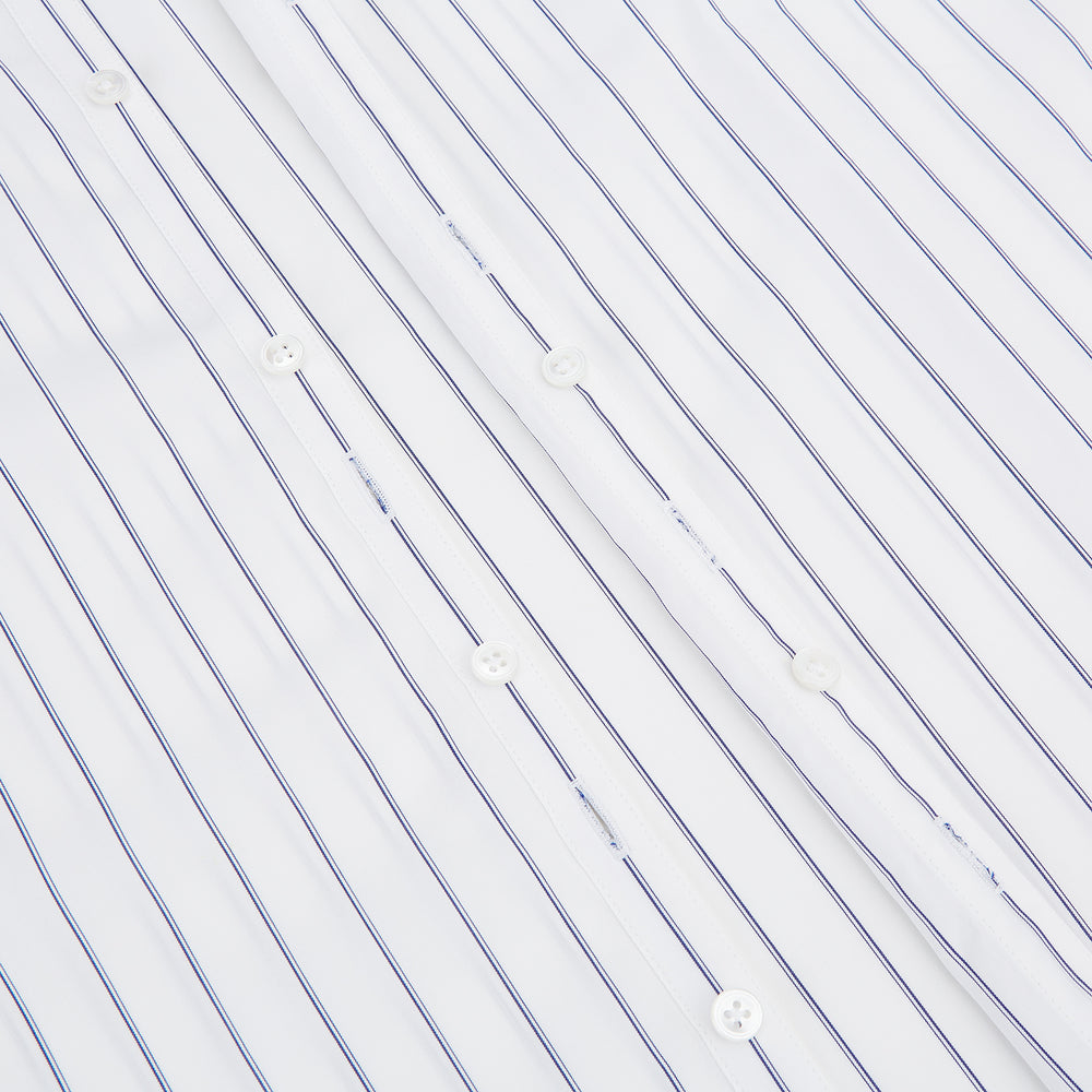 The Dark Navy Double-Pinstripe Westminster Shirt by Turnbull & Asser, featuring a Turnbull collar and cuffed sleeves, is displayed laid flat on a plain white background, highlighting its British craftsmanship.