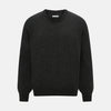 View 1 of product The Turnbull & Asser Dark Grey Cashmere Round Neck Jumper features a classic, plain long-sleeve design and is displayed on a white background.