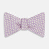 View 1 of product The Turnbull & Asser Lilac Flower Patterned Silk Bow Tie showcases small white flowers on lilac silk, making it a refined accessory for smart outfits. Shown against a white background.