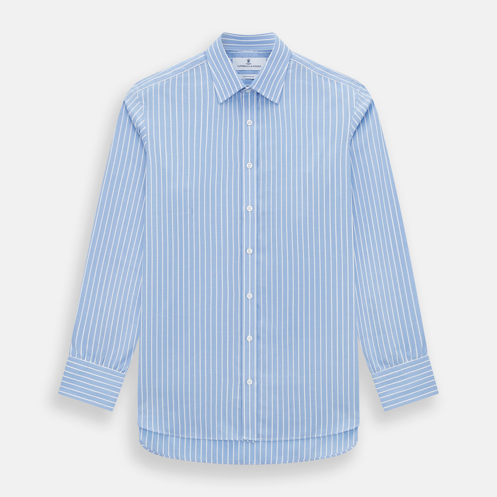 The Turnbull & Asser Sky Blue Wide Pinstripe Mayfair Shirt features long sleeves, a classic collar, and buttoned cuffs, laid flat against a white background for a refined formal look.