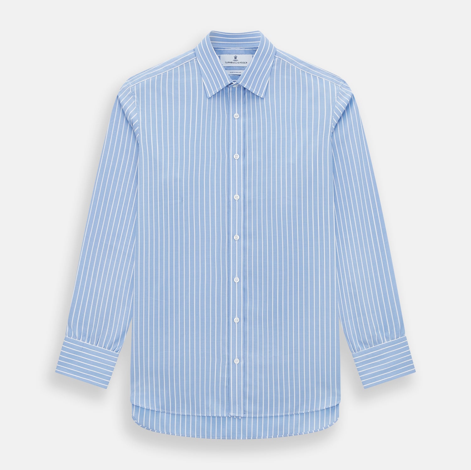 View 1 of product The Turnbull & Asser Sky Blue Wide Pinstripe Mayfair Shirt features long sleeves, a classic collar, and buttoned cuffs, laid flat against a white background for a refined formal look.