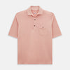 View 1 of product The Orange Polo Shirt by Turnbull & Asser features short sleeves, a collar, three-button placket, and a small buttoned chest pocket in soft cotton jersey—timeless men's style laid flat on a white background.