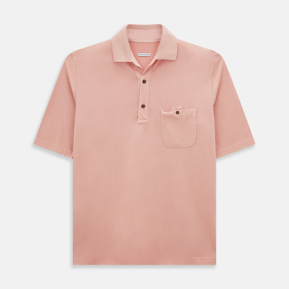 The Orange Polo Shirt by Turnbull & Asser features short sleeves, a collar, three-button placket, and a small buttoned chest pocket in soft cotton jersey—timeless men's style laid flat on a white background.