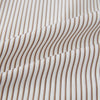 View 8 of product The Turnbull & Asser Coffee Multi Stripe Westminster Shirt features long sleeves, a button-up front, subtle beige and white stripes, a pointed Turnbull collar, and buttoned cuffs—expertly crafted in Britain and shown flat on a white background.