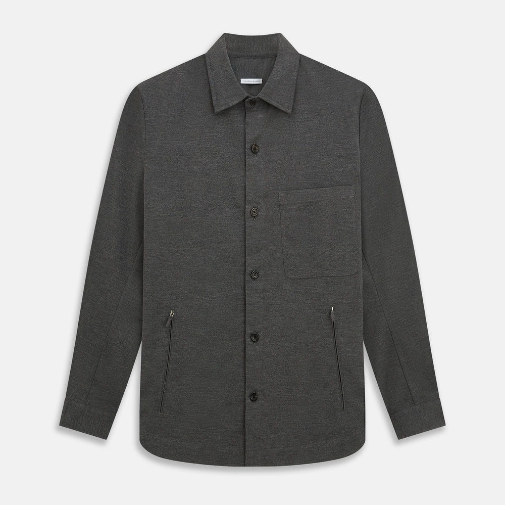 The Charcoal Melange Hampstead overshirt by Turnbull & Asser is a dark gray long-sleeve button-up with a collar, left chest pocket, and two zippered side pockets, shown laid flat on a white background.