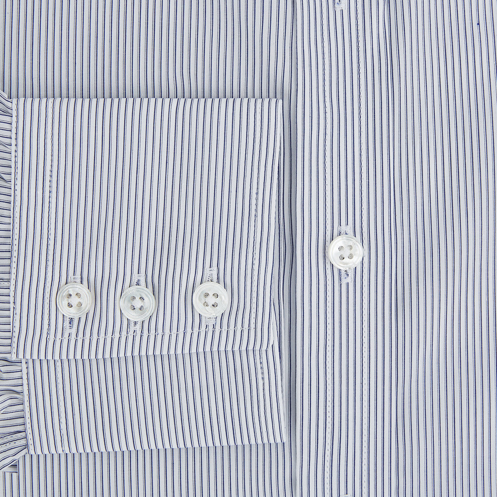 The Navy and White Ticking Stripe Mayfair Shirt by Turnbull & Asser features long sleeves, buttoned cuffs, a pointed T&A collar, and button-up front, shown on a plain white background.