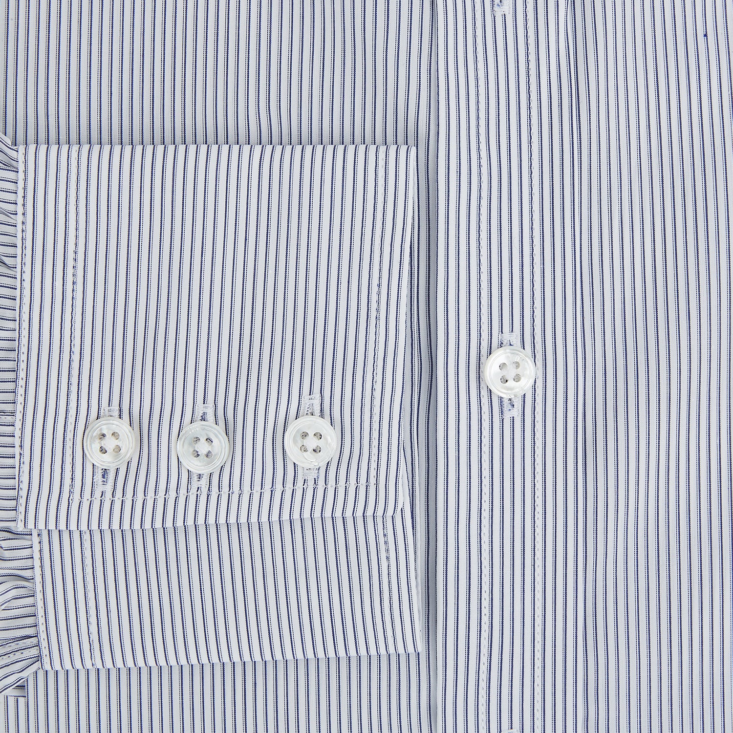 View 4 of product The Navy and White Ticking Stripe Mayfair Shirt by Turnbull & Asser features long sleeves, buttoned cuffs, a pointed T&A collar, and button-up front, shown on a plain white background.