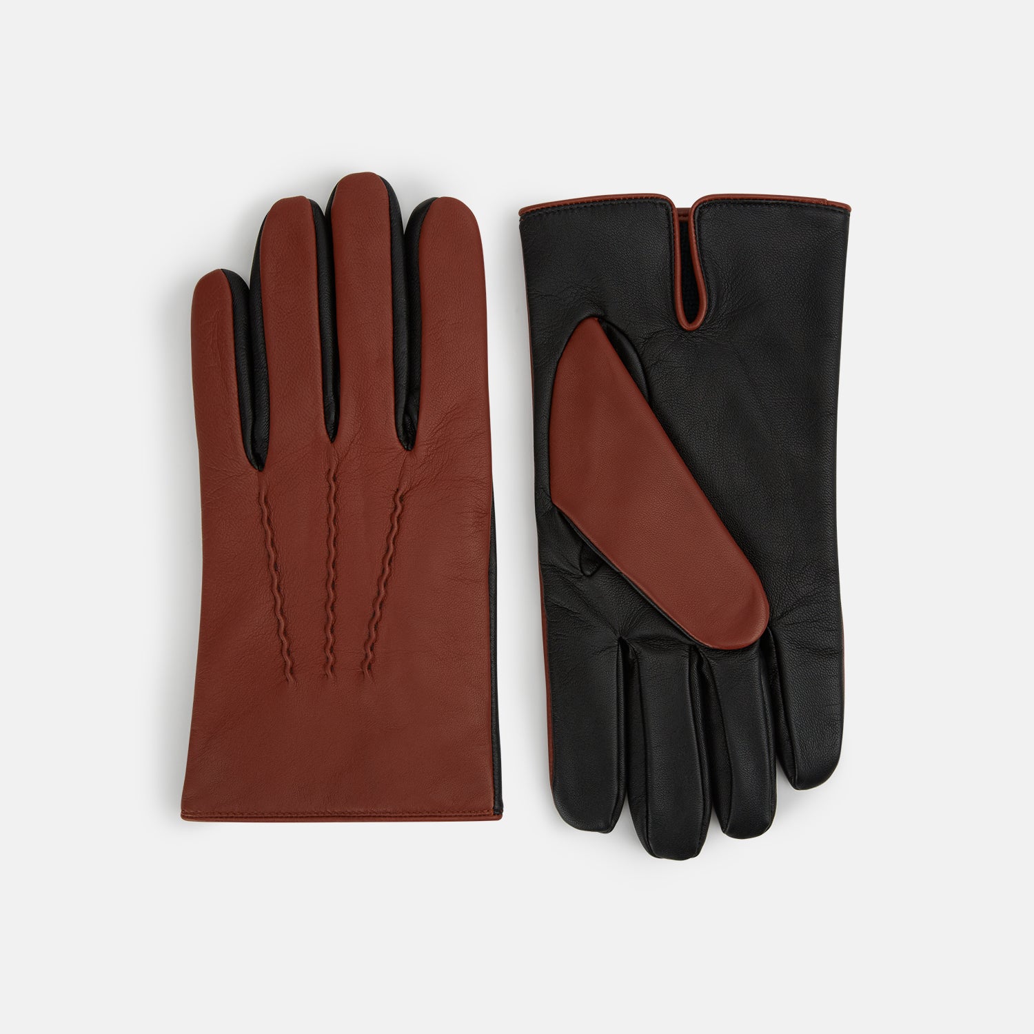 View 1 of product Turnbull & Asser Brown/Ebony Cashmere-Lined Hairsheep Leather Touchscreen Gloves are shown front and back, featuring a brown outer with subtle stitching and black palms/fingers accented with brown at the thumb and wrist.