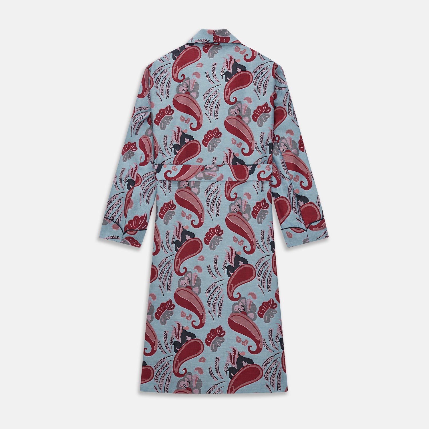 View 4 of product The Blue Paisley Pattern Cotton Arnold Gown by Turnbull & Asser features light blue jacquard cotton with a red and black paisley design, long sleeves, a matching belt, and two front pockets for a subtle Bloomsbury-inspired look.