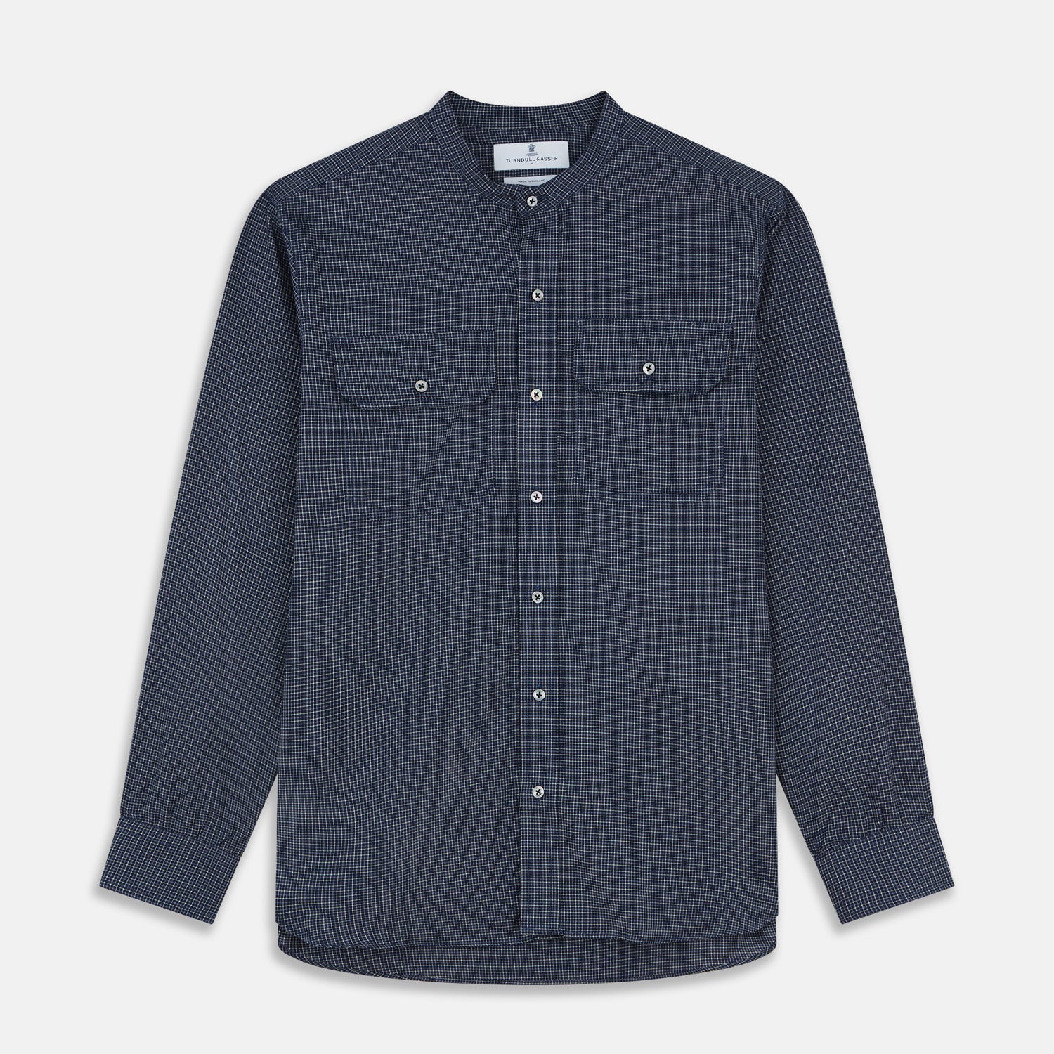 View 1 of product The Turnbull & Asser Navy Check Weekend Fit Flannel Shirt features a stand collar, button front, two chest pockets with flaps, and 1-button cuffs, crafted from soft Italian cotton and shown laid flat on a white background.