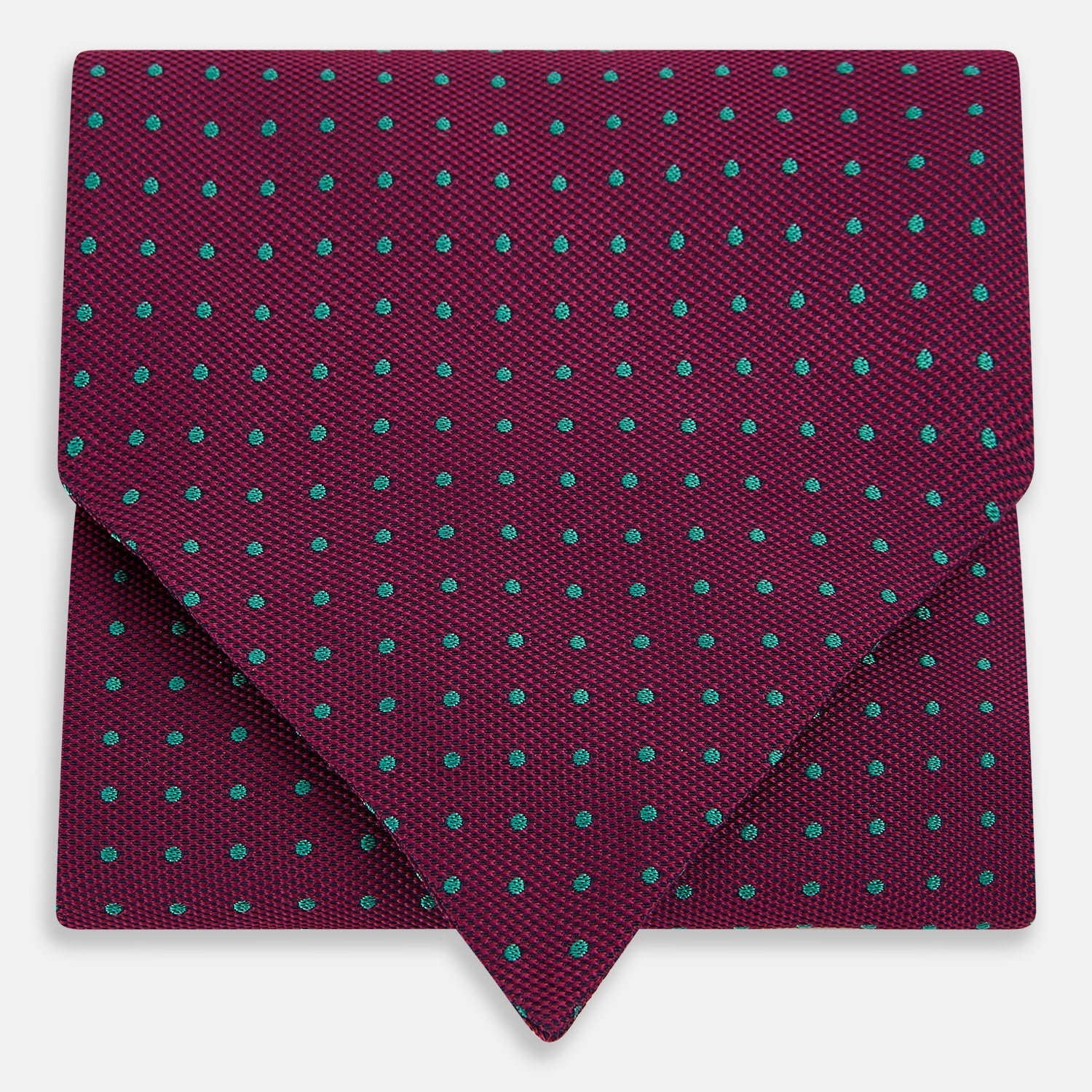 View 1 of product A burgundy pocket square with turquoise polka dots, folded to a point—an ideal men's formal accessory to complement the Green Micro Dot and Magenta Silk Cravat by Turnbull & Asser.