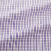 View 6 of product The Turnbull & Asser Purple Double Graph Check Mayfair Shirt is a long-sleeved, button-up dress shirt with a T&A collar and small blue and white check pattern, shown against a white background.