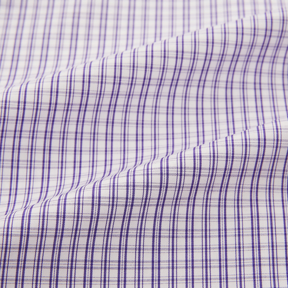 The Turnbull & Asser Purple Double Graph Check Mayfair Shirt is a long-sleeved, button-up dress shirt with a T&A collar and small blue and white check pattern, shown against a white background.