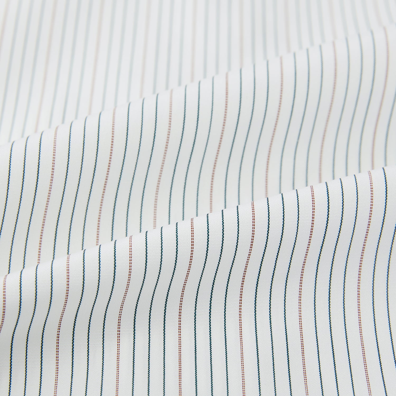 View 6 of product The Petrol Hairline Stripe Mayfair Shirt by Turnbull & Asser is a long-sleeved, button-up Italian cotton shirt with a subtle blue pinstripe, classic T&A collar, and buttoned cuffs, shown flat on a white background.