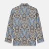 View 6 of product The Turnbull & Asser Pale Blue Baroque Silk-blend Hyde Pyjama Set features a long-sleeve button-up shirt and pants in a blue and beige paisley pattern, shown flat on a white background.