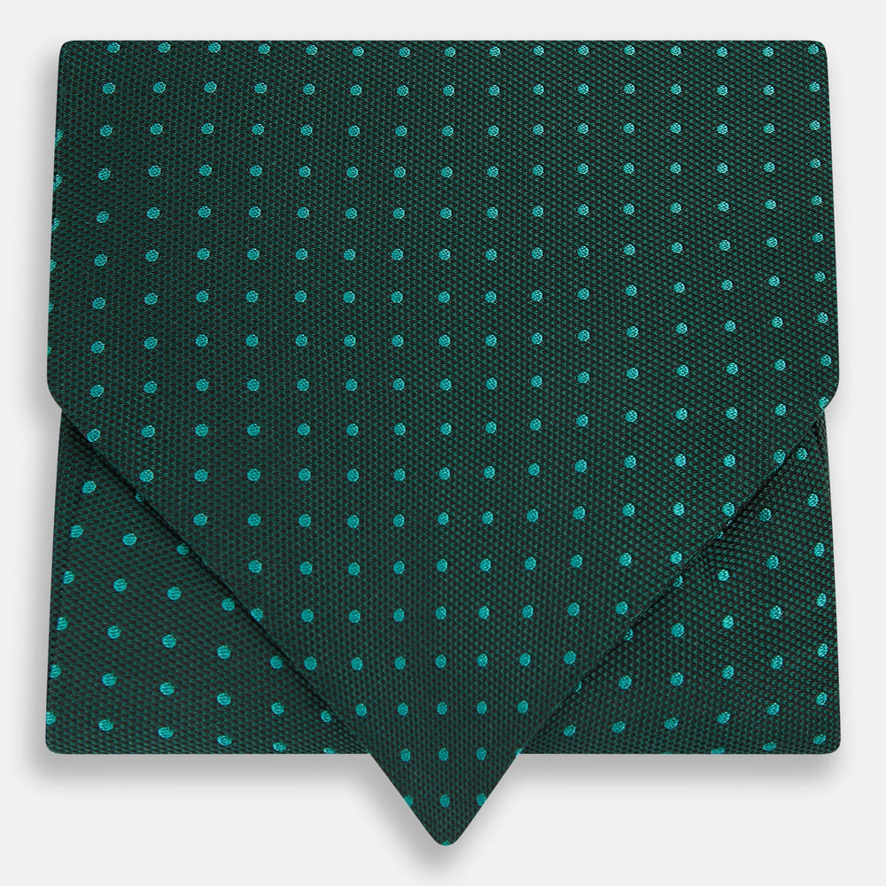 The Turnbull & Asser Blue and Forest Green Micro Dot Silk Cravat pairs perfectly with a dark green pocket square featuring light blue micro dots, ideal for formal looks or adding distinction to your ensemble.