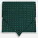 The Turnbull & Asser Blue and Forest Green Micro Dot Silk Cravat pairs perfectly with a dark green pocket square featuring light blue micro dots, ideal for formal looks or adding distinction to your ensemble.