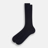 View 2 of product A single navy mid-length sock by Turnbull & Asser, crafted from organic cotton with a ribbed texture, stands upright on a white background.