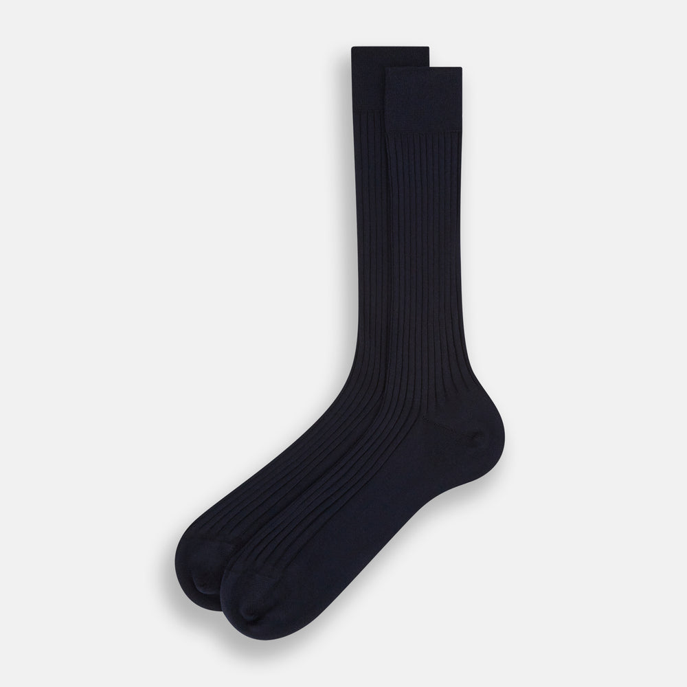 A single navy mid-length sock by Turnbull & Asser, crafted from organic cotton with a ribbed texture, stands upright on a white background.