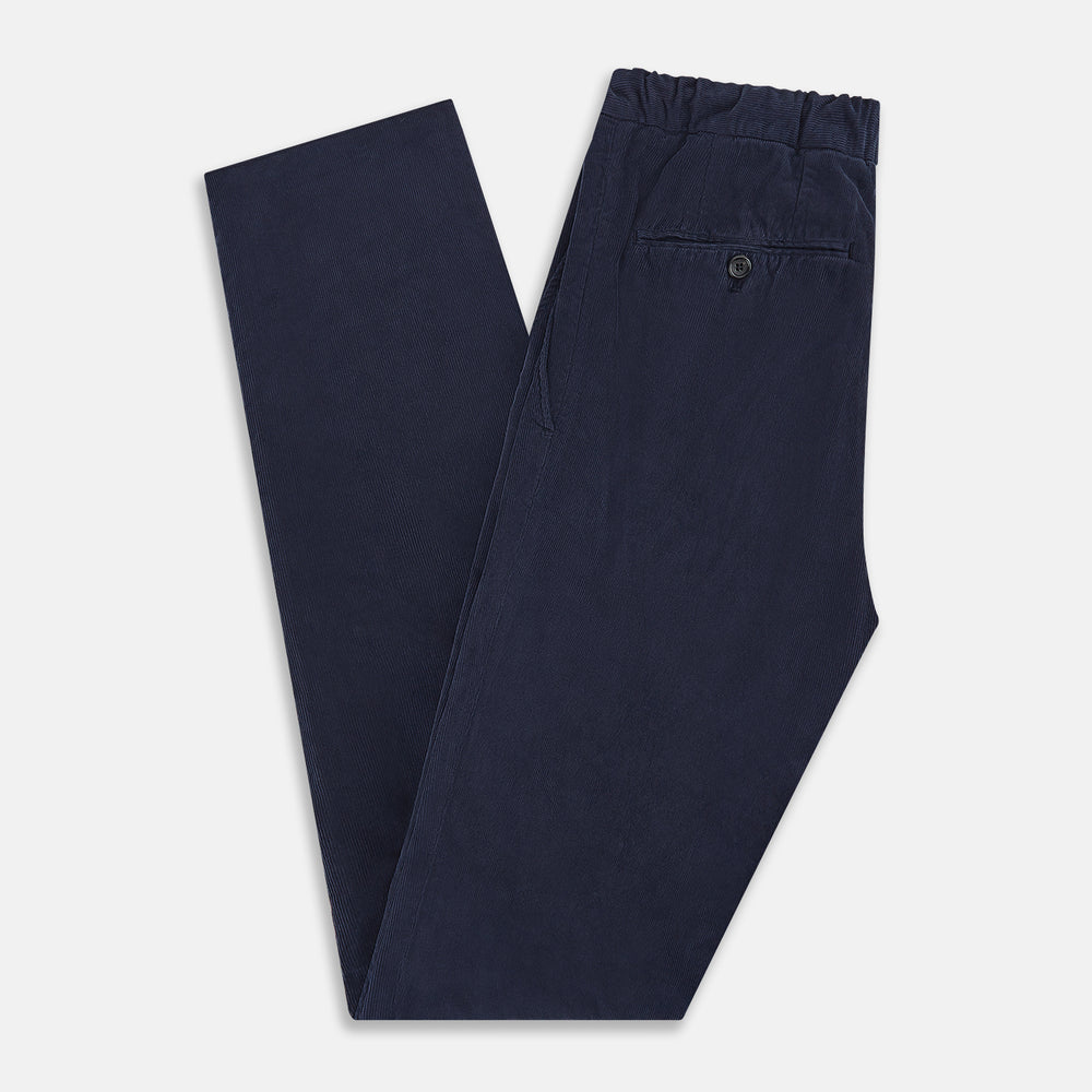 Turnbull & Asser's Light Navy Corduroy Miles Trousers feature a straight-leg stretch fit, elasticated waist, and matching fabric drawstring, shown on a plain white background.